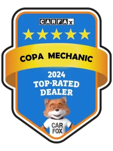 Award badge showing "CARFAX 2024 Top-Rated Dealer" with Copa Mechanic name and Car Fox mascot.